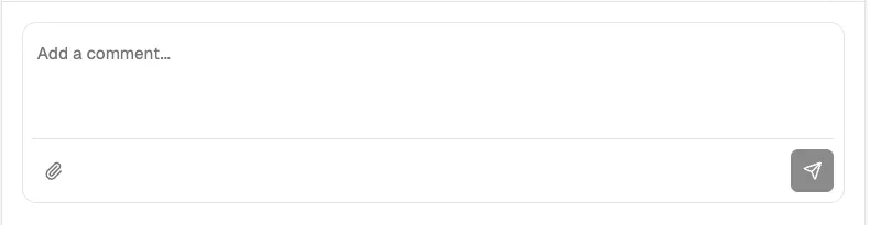 The comment input toolbar showing the attach button (paperclip icon) for adding images