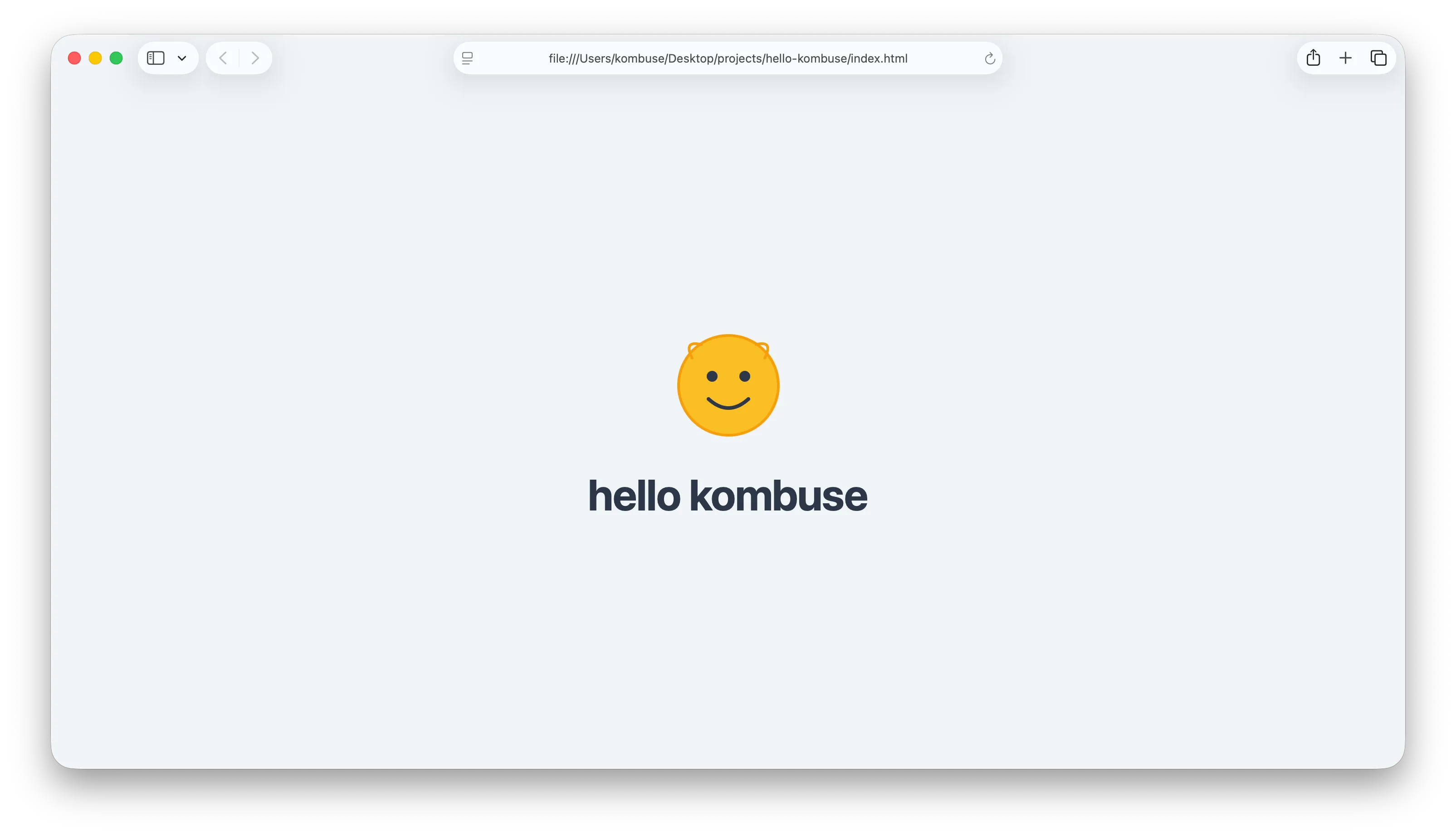 The finished greeting page showing 'hello kombuse' with a smiley face SVG, opened in a browser